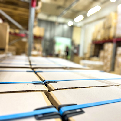 stacked-boxes-strapped-pallet-warehouse